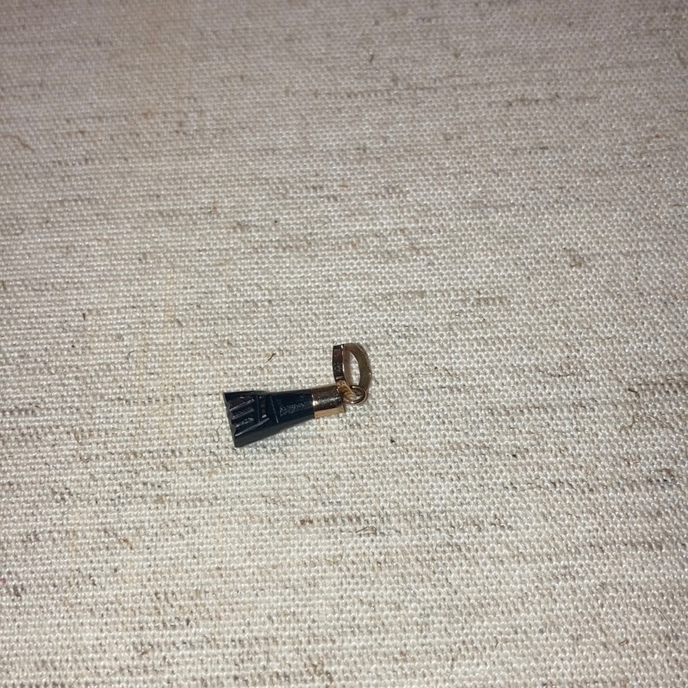 14kt gold black azabache charm.